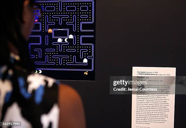 Janelle Grace plays "Pac-Man" which is one of the 14 video games that are part of the exhibiton "Applied Designs" during the "Applied Design" press...