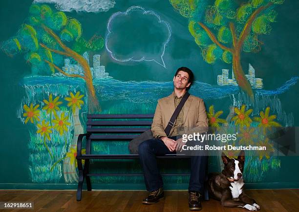 a man and dog sitting on a park bench thinking. - mural portrait stock pictures, royalty-free photos & images