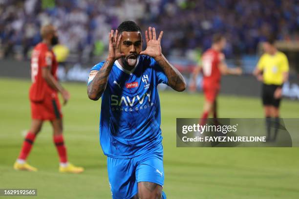 Hilal's Brazilian forward Malcom celebrates during the Saudi Pro League football match between Al-Hilal and Al-Ettifaq at Prince Faisal Bin Fahd...