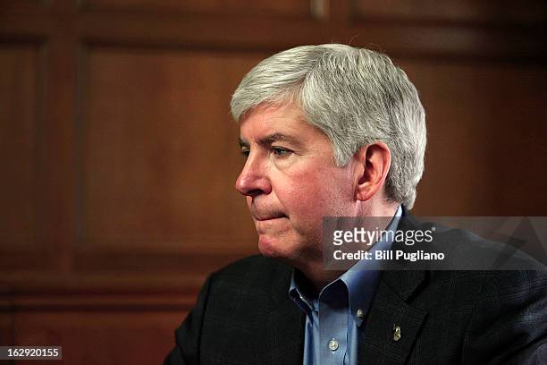 Michigan Governor Rick Snyder talks with the news media after announcing that he will appoint an Emergency Financial Manager for the city of Detroit...