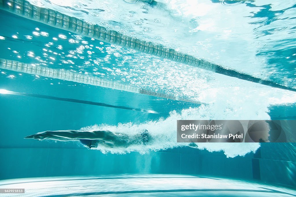 Swimmer underwater after the jump