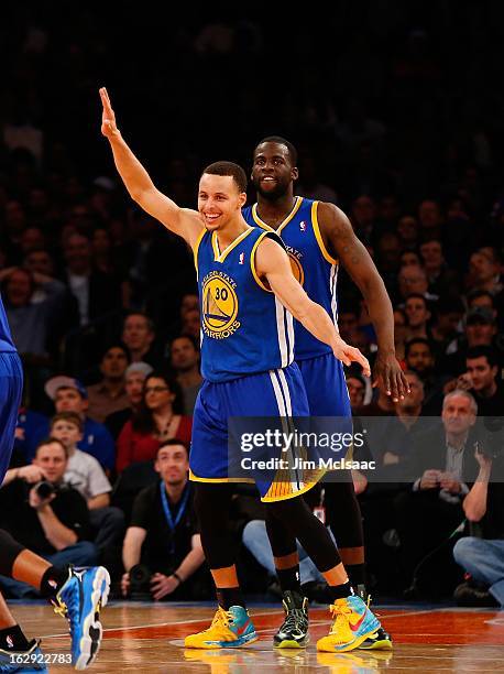 Stephen Curry of the Golden State Warriors reacts after scoring his 50th point of a game against the New York Knicks at Madison Square Garden on...