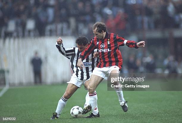 Robertio Baggio of Juventus takes on Franco Baresi of AC Milan during a Serie A match at the San Siro Stadium in Milan, Italy. Juventus won the match...