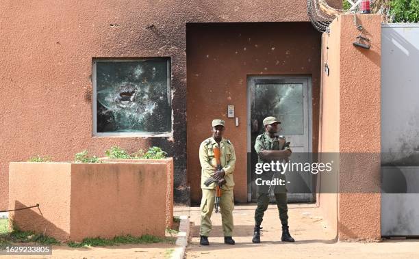 Officers of the Niger national Police are seen in front of the French Embassy in Niamey on August 28, 2023. Thousands of people demonstrated on...