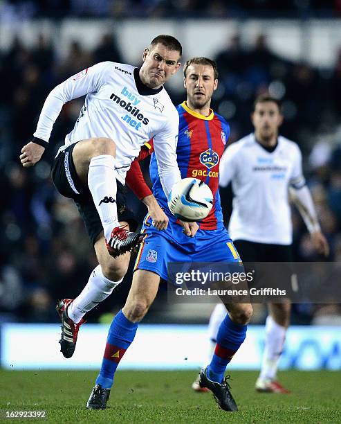 Jake Buxton of Derby County battles with Glenn Murray of Crystal Palace during the npower Championship match between Derby County and Crystal Palace...