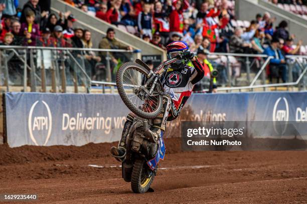 Dan Bewley celebrates with a wheelie during the Sports Insure Premiership match between Belle Vue Aces and Leicester Lions at the National Speedway...