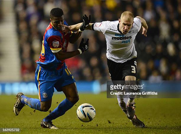 Gareth Roberts of Derby County battles with Wilfried Zaha of Crystal Palace during the npower Championship match between Derby County and Crystal...