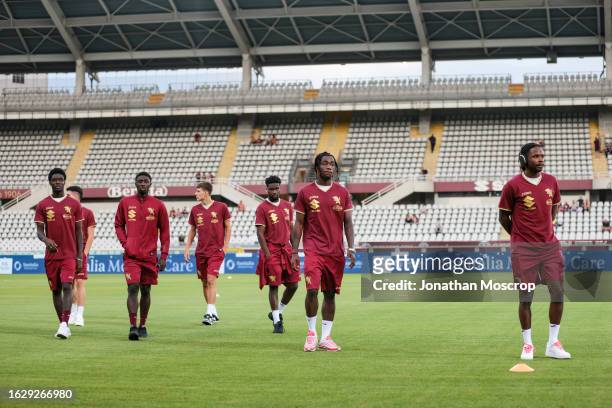 Adrien Tameze, Yann Karamoh, Ange N'Guessan,Ali Dembele, Brian Bayeye and Gvidas Gineitis of Torino FC leave the field of play following the team's...