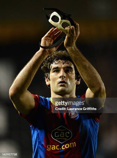 Mile Jedinak of Crystal Palace applauds the travelling fans during the npower Championship match between Derby County and Crystal Palace at Pride...