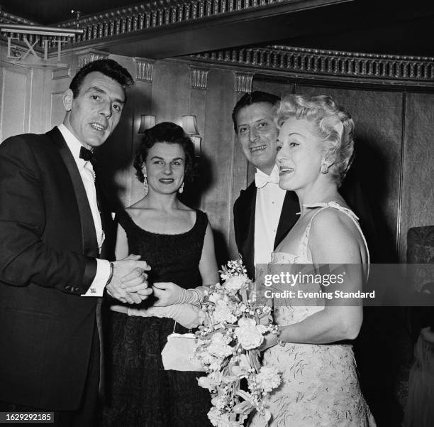 Comedian Erik Sykes with his wife Edith Sykes , theatre impresario Bernard Delfont and his wife, actress Carol Lynne at the Dorchester Hotel annual...