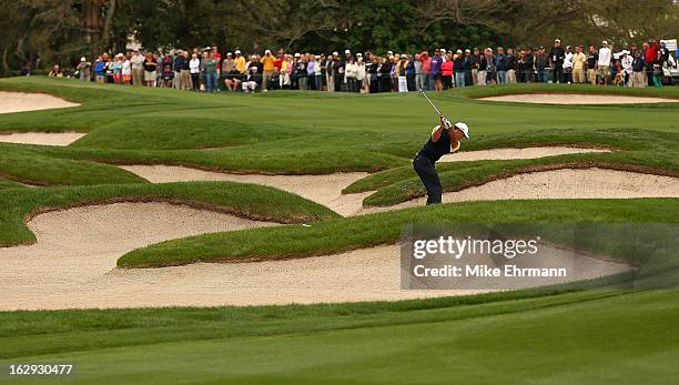 Tiger Woods out of the fairway bunker on the 13th hole during the second round of the Honda Classic at PGA National Resort and Spa on March 1, 2013...