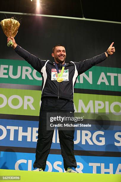 Gold medalist Asmir Kolasinac of Serbia poses during the victory ceremony for the Men's Shot Put during day one of the European Athletics Indoor...