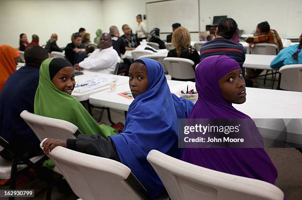 Recently-arrived refugees from Somalia learn about how to receive food stamps during a class held by the Arizona Department of Economic Security at...