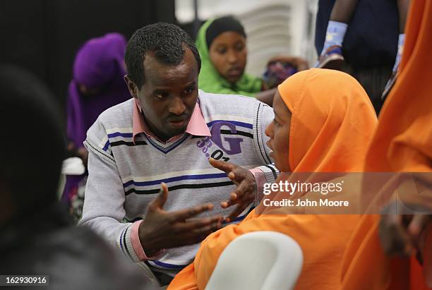 Recently-arrived refugees from Somalia learn about how to receive food stamps during a class held by the Arizona Department of Economic Security at...