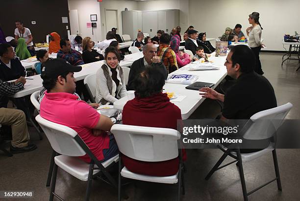 Recently-arrived refugees from Iran learn about how to receive food stamps during a class held by the Arizona Department of Economic Security at the...