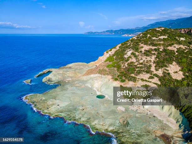 trachyte coast in bosa marina - sardinia, italy - oristano stockfoto's en -beelden