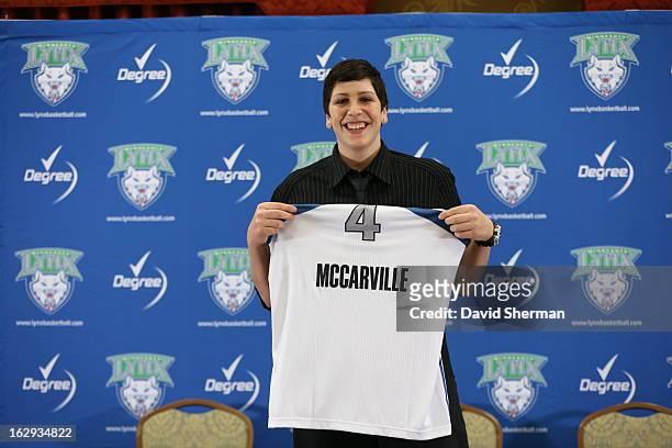 Janel McCarville of the Minnesota Lynx holds her new jersey after being introduced to the media during a press conference on March 1, 2013 at the...