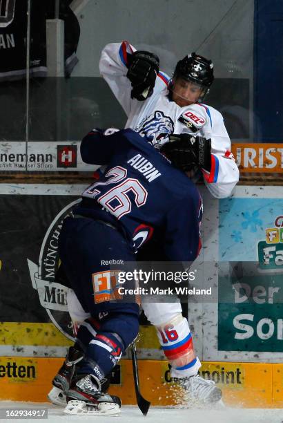 Eric Chouinard of Thomas Sabo Ice Tigers fights with Brent Aubin of EHC Red Bull Muenchen during the DEL match between EHC Red Bull Muenchen and...