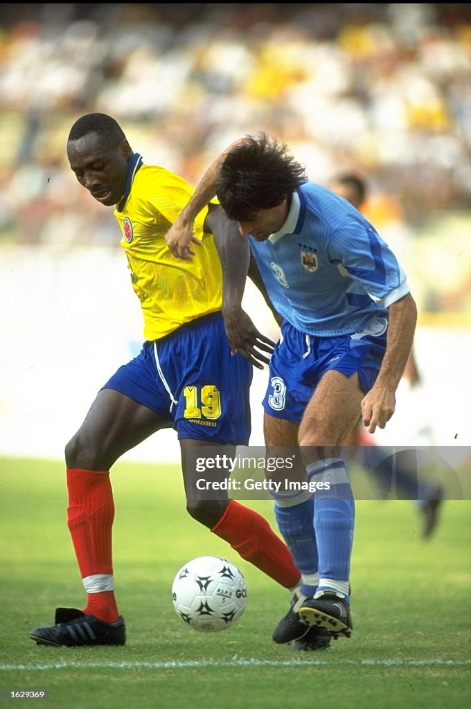Freddy Rincon Freddy Rincon of Colombia holds off Moas of Uruguay during the World ...
