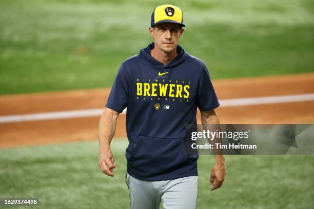 Craig Counsell of the Milwaukee Brewers walks off the field in the sixth inning against the Texas Rangers at Globe Life Field on August 19, 2023 in...