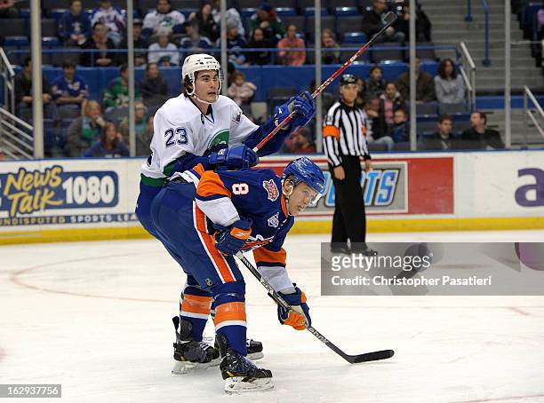 Nathan McIver of the Bridgeport Sound Tigers and Brandon Mashinter of the Connecticut Whale battle for position in front of the net during during an...