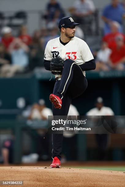 Dane Dunning of the Texas Rangers throws a pitch in the first inning against the Milwaukee Brewers at Globe Life Field on August 19, 2023 in...