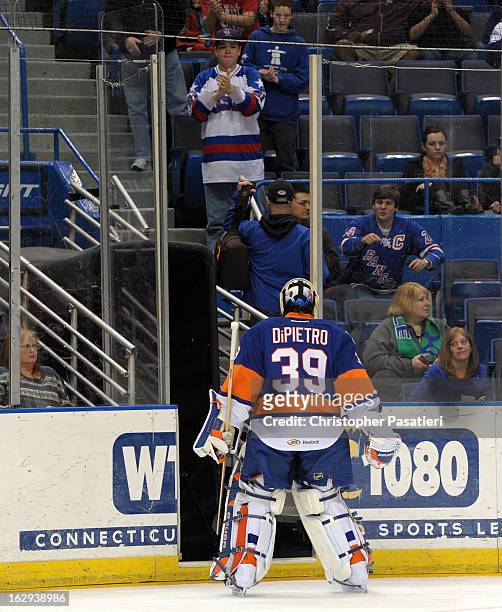 Rick DiPietro of the Bridgeport Sound Tigers skates off the ice after allowing five goals in the first period of an American Hockey League game...