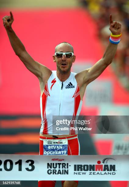 Bevan Docherty of New Zealand celebrates winning the New Zealand Ironman on March 2, 2013 in Taupo, New Zealand.