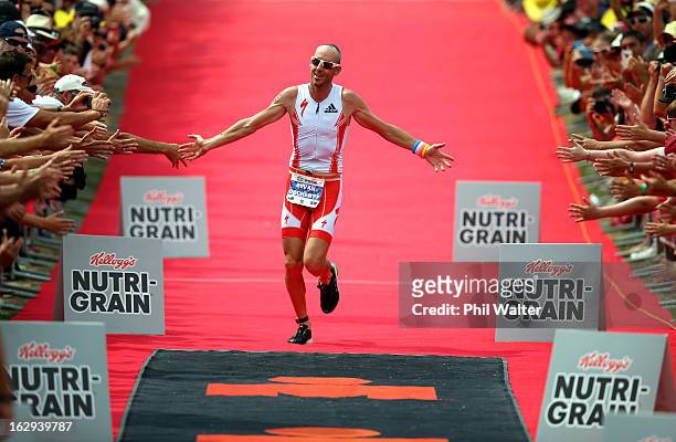 Bevan Docherty of New Zealand celebrates winning the New Zealand Ironman on March 2, 2013 in Taupo, New Zealand.