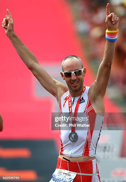 Bevan Docherty of New Zealand celebrates winning the New Zealand Ironman on March 2, 2013 in Taupo, New Zealand.