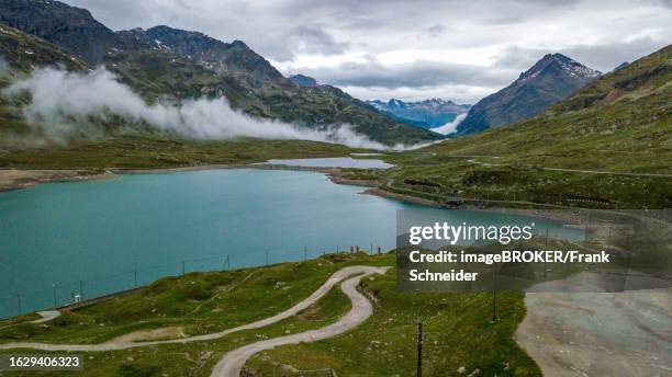 Aerial view bird's eye view of mountain lake at mountain pass alpine mountain road pass road Bernina Pass Bernina Pass, Swiss Alps, Canton Grisons, Switzerland