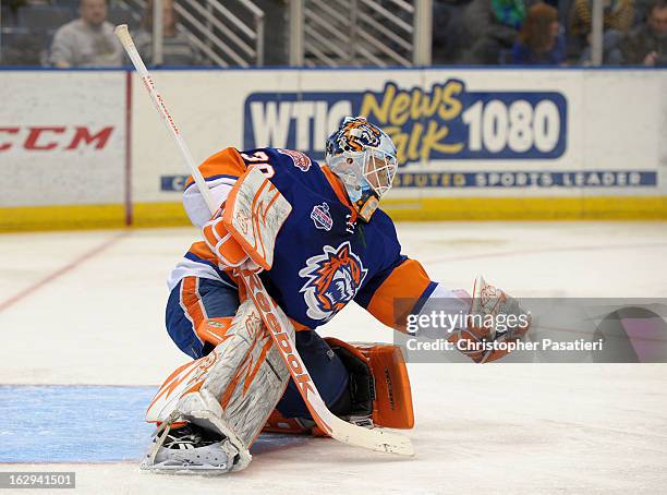 Kenny Reiter of the Bridgeport Sound Tigers makes a glove save during an American Hockey League game against the Connecticut Whale on March 1, 2013...