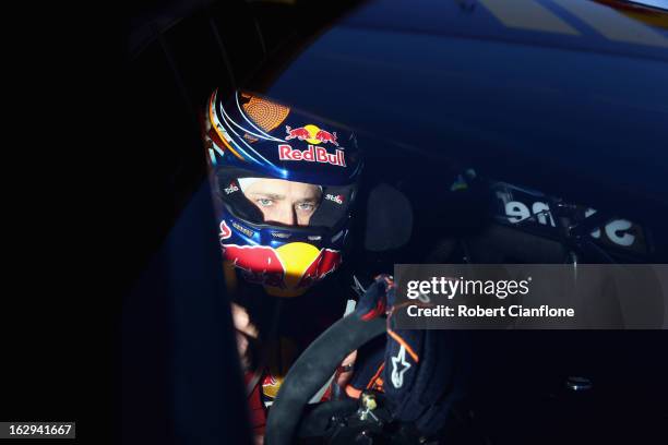 Casey Stoner driver of the Red Bull Pirtek Holden sits in his car prior to race two for round one of the V8 Supercars Dunlop Development Series at...