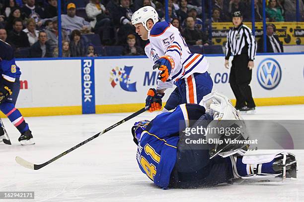 Jaroslav Halak of the St. Louis Blues makes a save against Ben Eager of the Edmonton Oilers at the Scottrade Center on March 1, 2013 in St. Louis,...