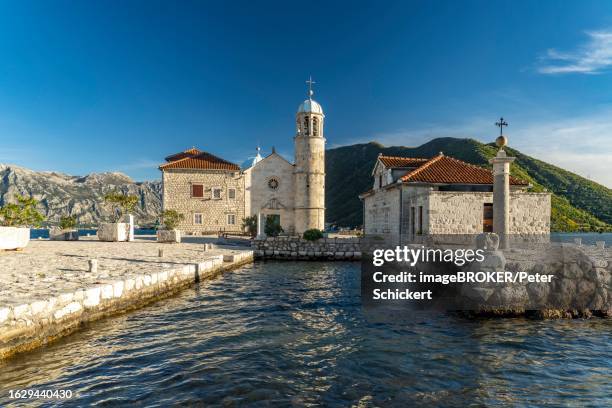 the artificial island of gospa od skrpjela with the church of st. mary on the rock near perast on the bay of kotor, montenegro - gospa od skrpjela stock pictures, royalty-free photos & images