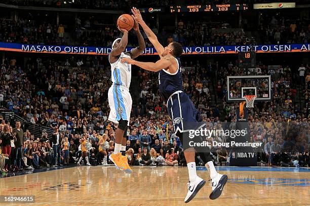 Ty Lawson of the Denver Nuggets makes the game winning shot over Thabo Sefolosha of the Oklahoma City Thunder in the finals seconds at the Pepsi...