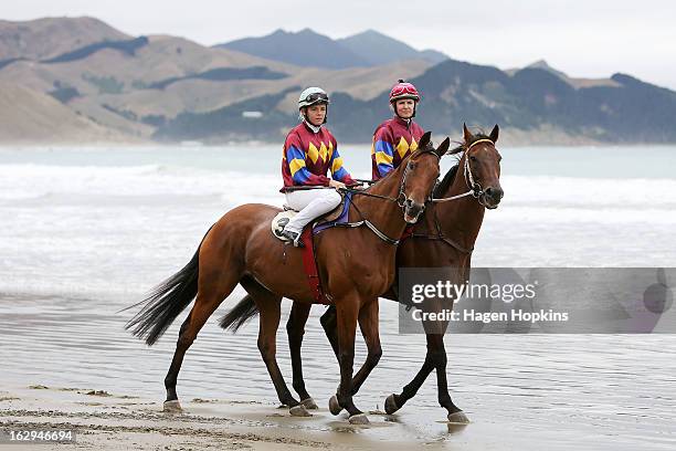 Petushki and Mr Composed make their way to the start of the Tinui Highweight Handicap Open during the Castlepoint Beach Races at Castlepoint Beach on...