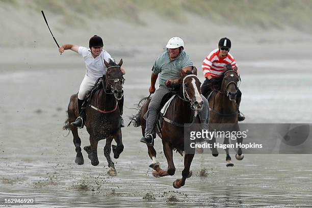 Jockey Kingi Winiata leads out on his way to winning the Stewards Handicap during the Castlepoint Beach Races at Castlepoint Beach on March 2, 2013...