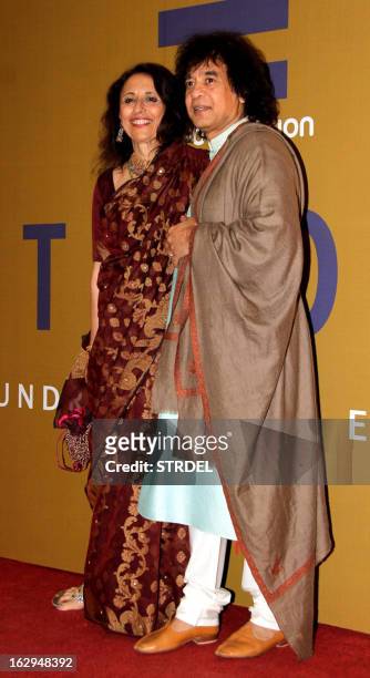 Indian musician Zakir Hussain and his wife Antonia Minnecola attend the NGO fund raiser Equation 2013, sponsored by Bollywood actor Rahul Bose in...