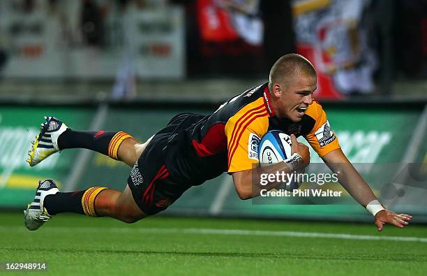 Gareth Anscombe of the Chiefs scores a try during the round three Super Rugby match between the Chiefs and the Cheetahs at Waikato Stadium on March...