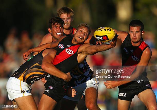 Leroy Jetta of the Bombers is tackled during the round two AFL NAB Cup match between the Essendon Bombers and the Richmond Tigers at Wangaratta...