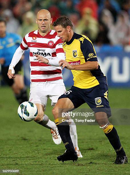 Patrick Zwaanswijk controls the ball ahead of Dino Kresingerduring the round 23 A-League match between the Central Coast Mariners and the Western...