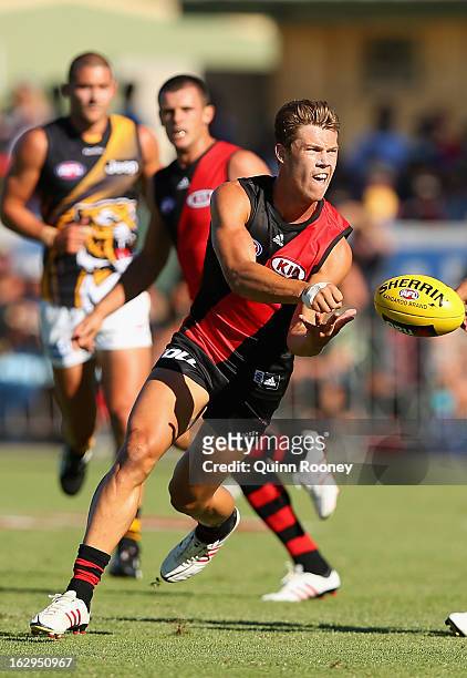 Jake Melksham of the Bombers handballs during the round two AFL NAB Cup match between the Essendon Bombers and the Richmond Tigers at Wangaratta...
