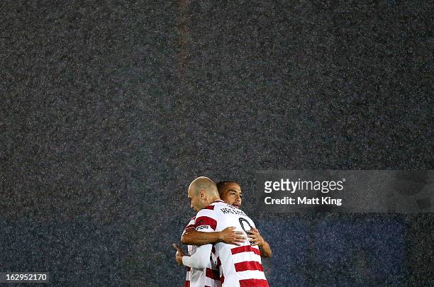 Dino Kresinger and Shinji Ono of the Wanderers embrace before the start of the round 23 A-League match between the Central Coast Mariners and the...