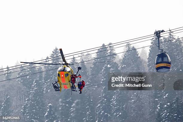 Alice McKennis of the USA is loaded into the emergency helicopter after crashing out of the Audi FIS Ski World Cup downhill race on March 02, 2013 in...