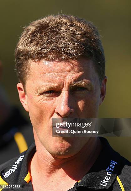 Damien Hardwick the coach of the Tigers looks on during the round two AFL NAB Cup match between the Essendon Bombers and the Richmond Tigers at...