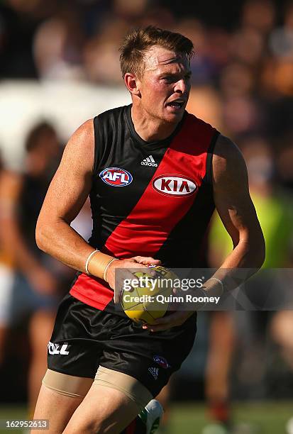 Brendon Goddard of the Bombers looks to pass the ball during the round two AFL NAB Cup match between the Essendon Bombers and the Richmond Tigers at...