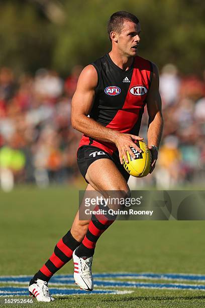 Brent Stanton of the Bombers kicks during the round two AFL NAB Cup match between the Essendon Bombers and the Richmond Tigers at Wangaratta...