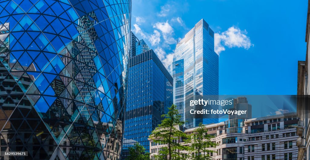 Gleaming glass skyscrapers towering into sky City of London panorama