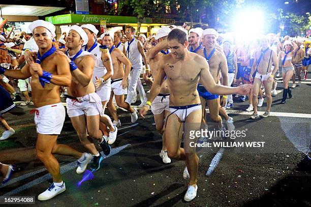 Marchers entertain the crowds in Sydney's annual Mardi Gras gay pride parade, an event which bills itself as the world's biggest night parade, on...